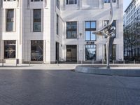 a skateboarder is riding in the middle of a city square of various buildings