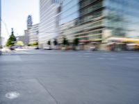 a person on a skateboard in the street with a blurry image behind them