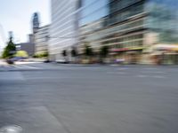 a person on a skateboard in the street with a blurry image behind them