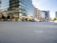 a person on a skateboard in the street with a blurry image behind them