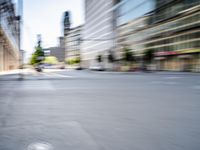 a person on a skateboard in the street with a blurry image behind them