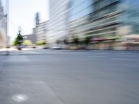 a person on a skateboard in the street with a blurry image behind them