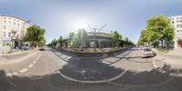 a person is riding a skateboard down the street in an image that appears to be a 360 - view