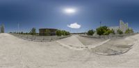 the view from a fish eye lens on a skateboarder doing tricks in the city