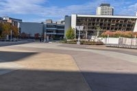 a red skateboarder riding a skate ramp in the middle of an empty city