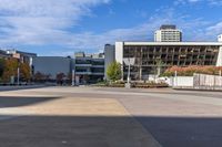 a red skateboarder riding a skate ramp in the middle of an empty city