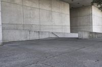 an image of a man on a skateboard in front of concrete wall with stairs