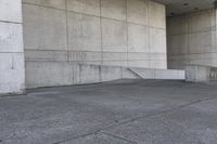 an image of a man on a skateboard in front of concrete wall with stairs