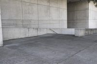 an image of a man on a skateboard in front of concrete wall with stairs