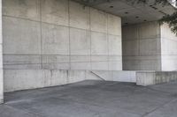 an image of a man on a skateboard in front of concrete wall with stairs