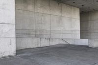 an image of a man on a skateboard in front of concrete wall with stairs