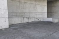 an image of a man on a skateboard in front of concrete wall with stairs