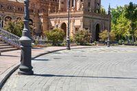 a person on a skateboard on a street in front of a building with a clock