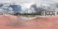 a skate boarder doing tricks in a very low air area near the entrance of a building