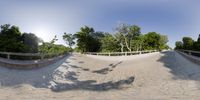 360 - angle view of skateboarding rider on concrete course on sunny day in urban area