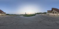 a skateboarder is performing tricks on the concrete ramps in a parking lot