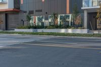 a man that is standing on a skateboard in the street next to some building