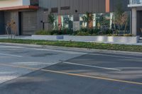 a man that is standing on a skateboard in the street next to some building