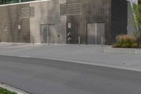 a person on a skateboard in front of a large building with a lot of windows