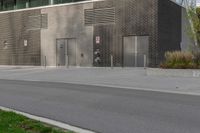 a person on a skateboard in front of a large building with a lot of windows