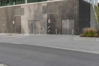 a person on a skateboard in front of a large building with a lot of windows