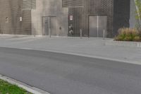 a person on a skateboard in front of a large building with a lot of windows