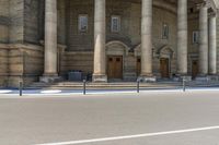 a man is skateboarding down the sidewalk of a church in front of a building