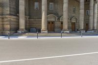 a man is skateboarding down the sidewalk of a church in front of a building