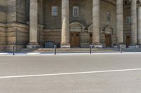 a man is skateboarding down the sidewalk of a church in front of a building