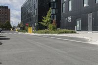 the man is skateboarding down the empty street by himself, in a parking lot