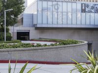 a person on a skateboard is doing a trick in front of the center of a building