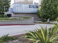 a person on a skateboard is doing a trick in front of the center of a building