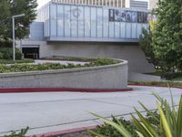 a person on a skateboard is doing a trick in front of the center of a building