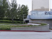 a person on a skateboard is doing a trick in front of the center of a building