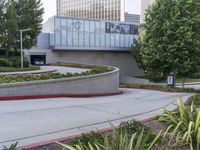 a person on a skateboard is doing a trick in front of the center of a building