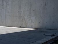 a person doing a trick on the skateboard in the cement park or outside the building