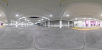 a skateboarder is doing a trick on his ramp in an underground parking garage