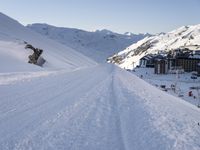 a snowboarder takes off into the snow as they make their way down a slope