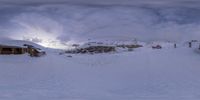 this is an image of ski resort on a snowy mountain slope in winter time and there are tracks from the slopes