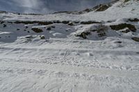 the person is coming down a mountain on their skis, all covered in snow