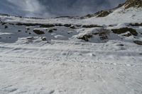 the person is coming down a mountain on their skis, all covered in snow