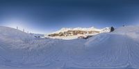 there is some snow and skis in the ground of a mountain scene for a ski article