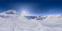 a skier rides the snow on a snowy surface and looks at the sky above him