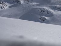 Skiing in the Alps: Clear Sky and Snowy Slopes