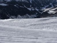 a person skiing down a hill on a sunny day of the winter time or some snow