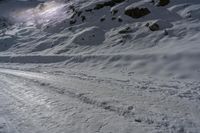 skiers make their way through the snowy slopes as he starts to ski down the mountain