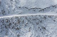 some people are skiing down a mountain in the snow together in this aerial shot by michael miller