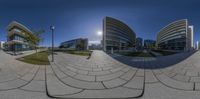 an image taken from within a 360 - camera lens of buildings on the waterfront outside a large city area