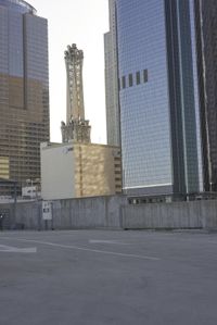 a group of skyscrapers near a bench in the city park with a skate board