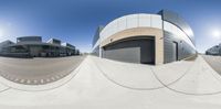 a fisheye photo of an office building in the sun taken in a 360 - view camera